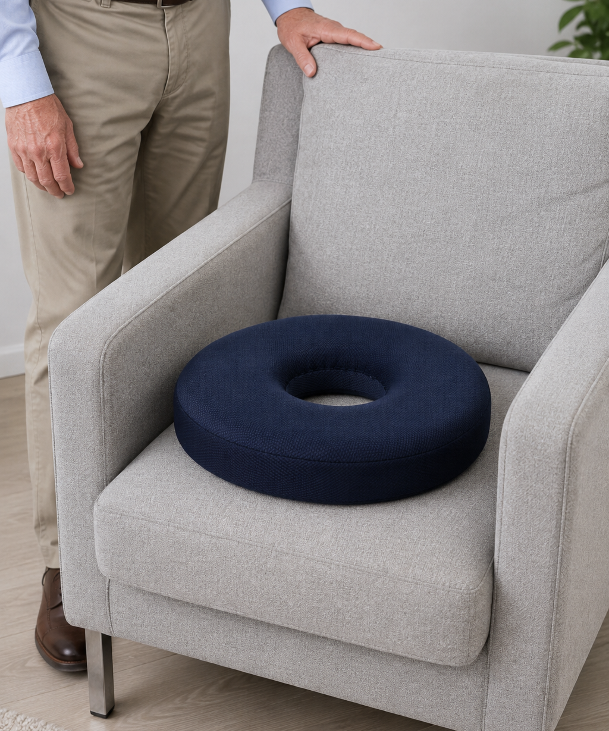 ring seat cushion placed on an armchair for comfortable sitting with lower back pain