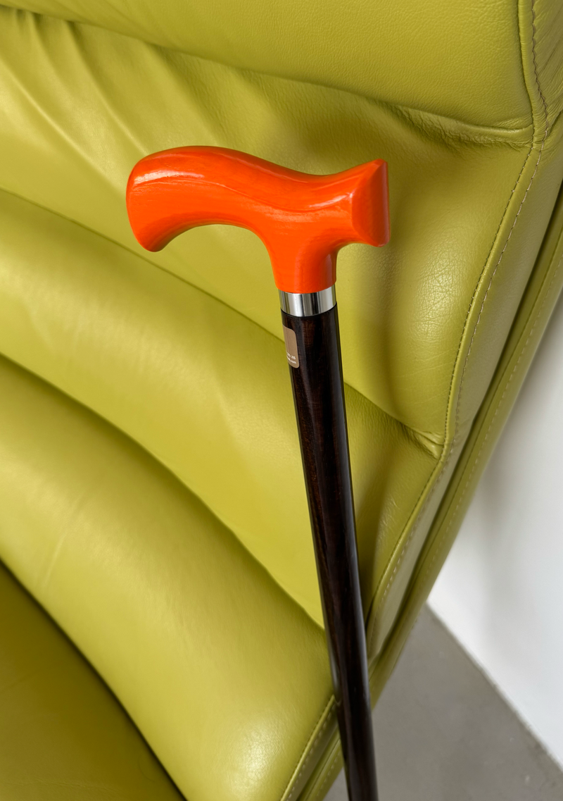 Orange ergonomic handle walking cane